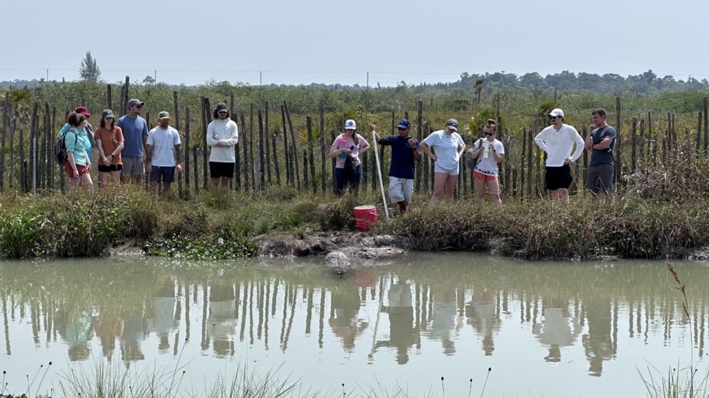 Vet students near a pond in Belize.