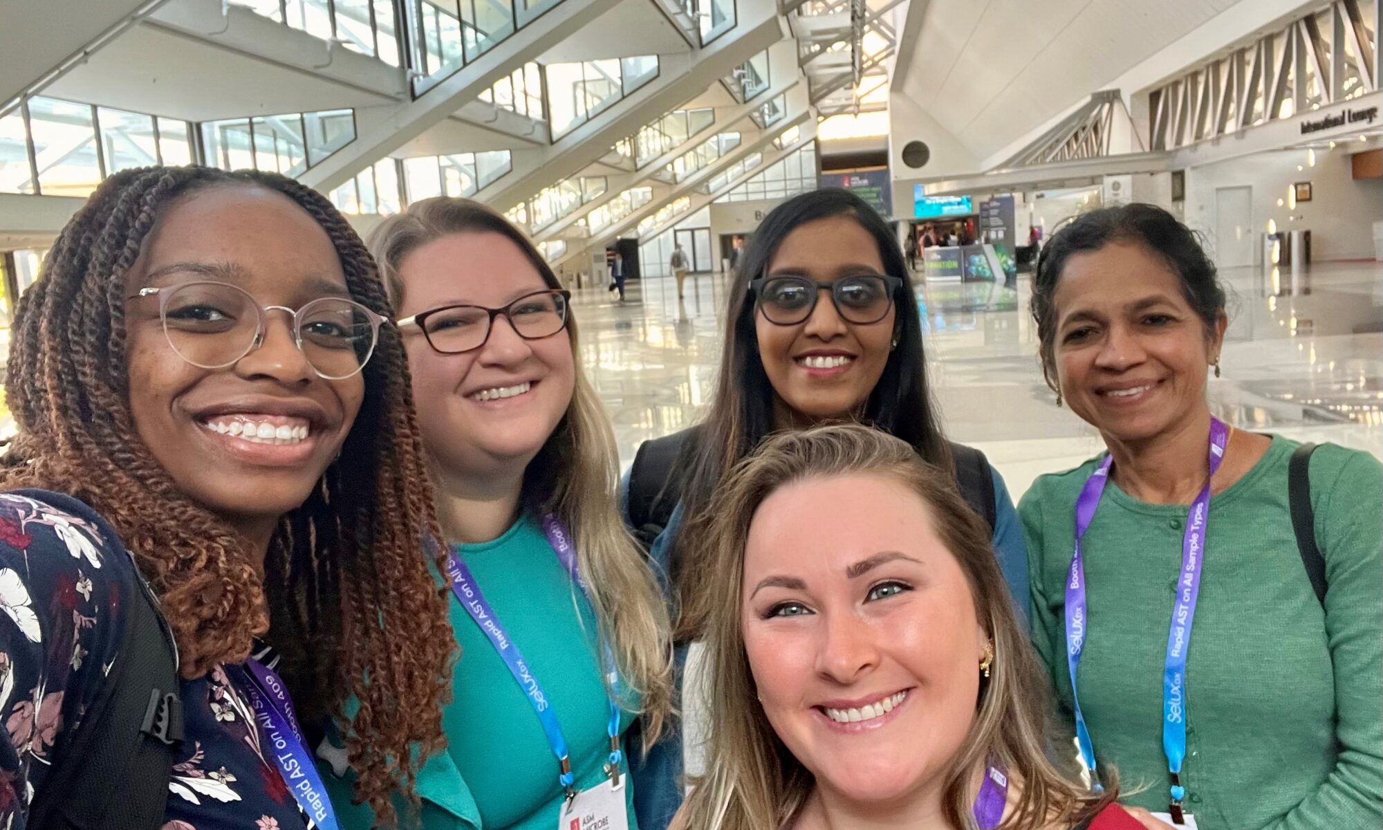 Microbiology lab members (from left to right) Bryanna Fayne, Porsha Reed, Swetha Madesh, Sreekumari Rajeev, and Liana Nunes-Barbosa (front) pose for a group photo at the conference.