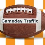 Image of football on orange and white checkerboard with Gameday Traffic written on football