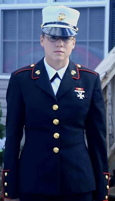 Female solder standing in dress uniform