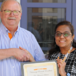 Dr. Sultana receiving her award from Dr. Anderson.
