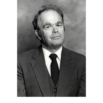 Dr. Hyram Kitchen in a suit and tie. 